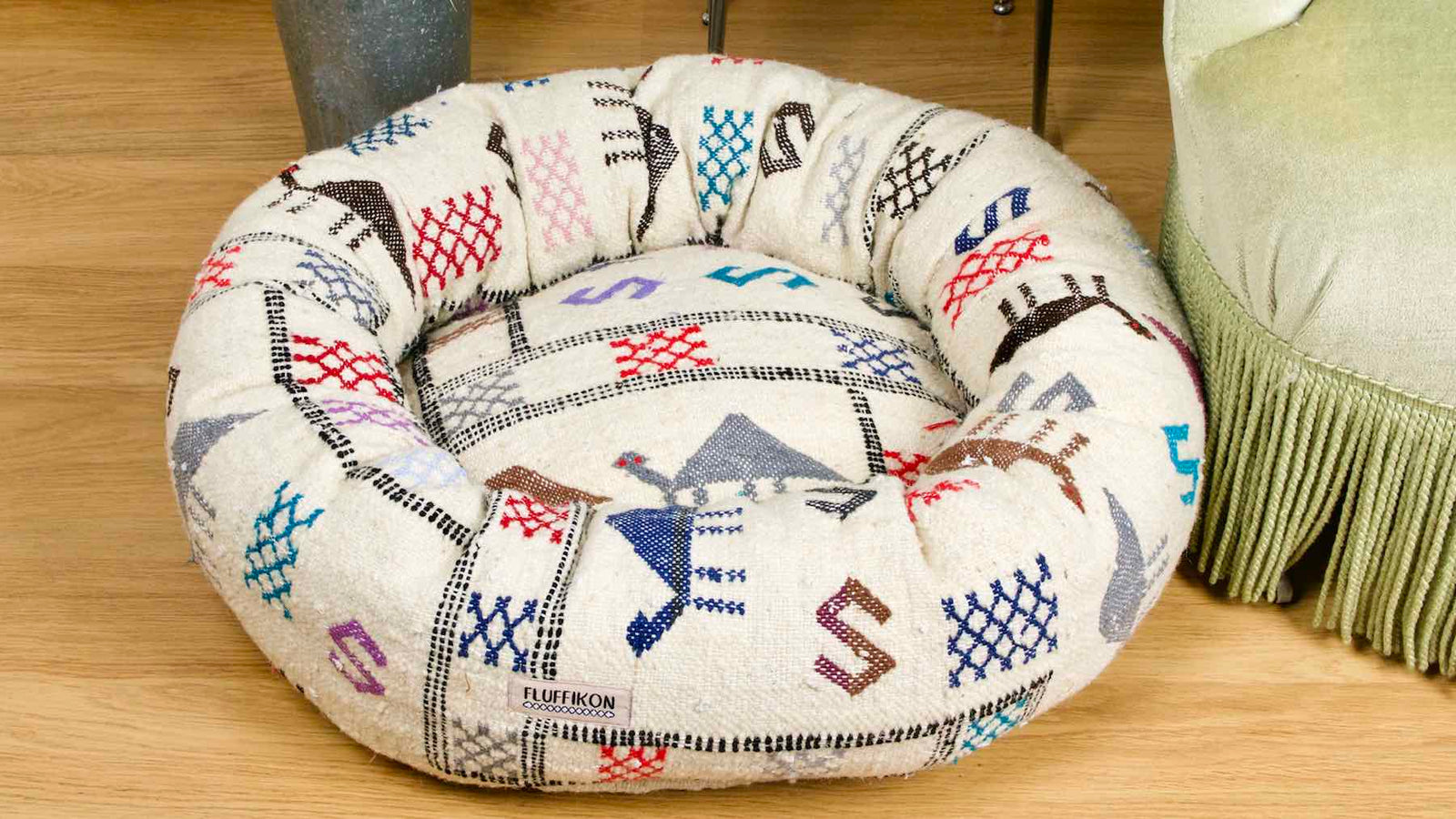 The customized Fluffikon wool dog bed that is made from a Moroccan wool Kilim rug.