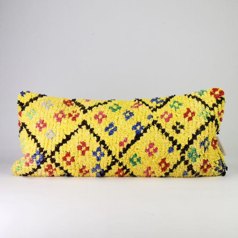 Yellow Boucherouite lumbar throw pillow. The lumbar pillow has the size 35x70 cm and is quite colorful.