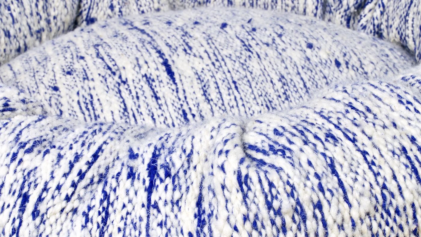 Zoom on blue and white Fluffikon Kilim dog bed that is made from a Moroccan rug.