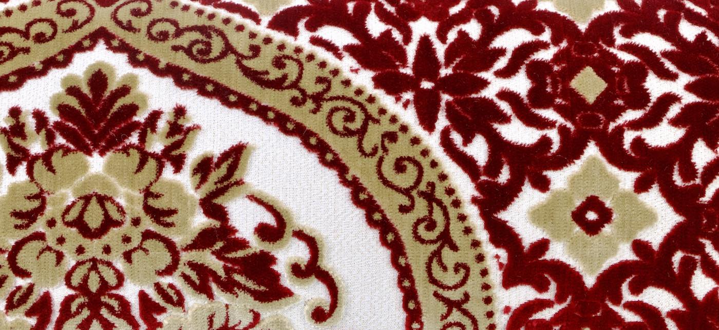Red yellow velvet fabric with traditional Moroccan patterns.