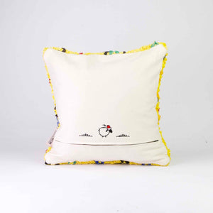 The back of a yellow Fluffikon Berber Cushion Cover. The pillows is made from an upcycled Boucherouite rug.