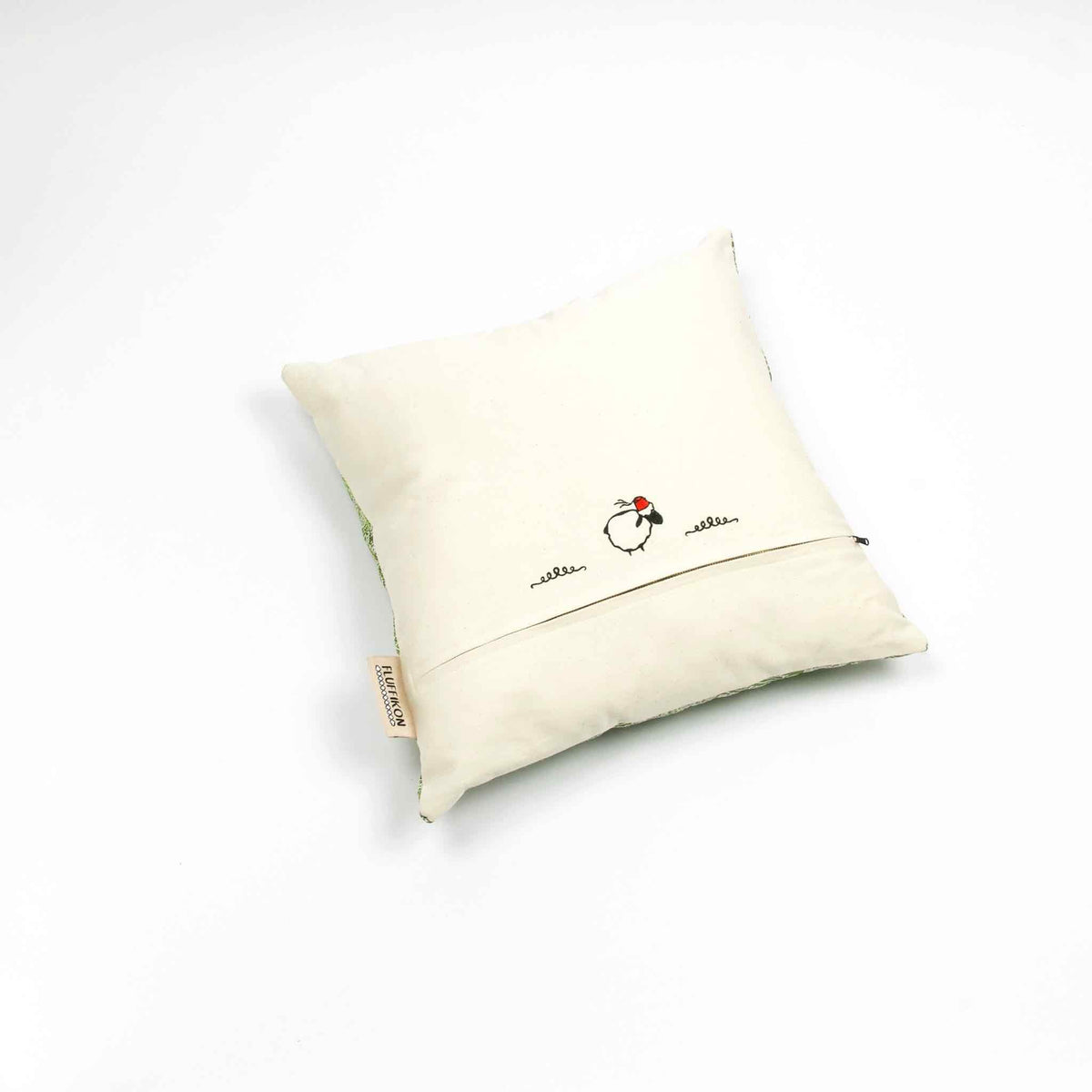 Fluffikon silk square pillow made from green moroccan fabric. The pillow is shown from the back. Size 45x45 cm.