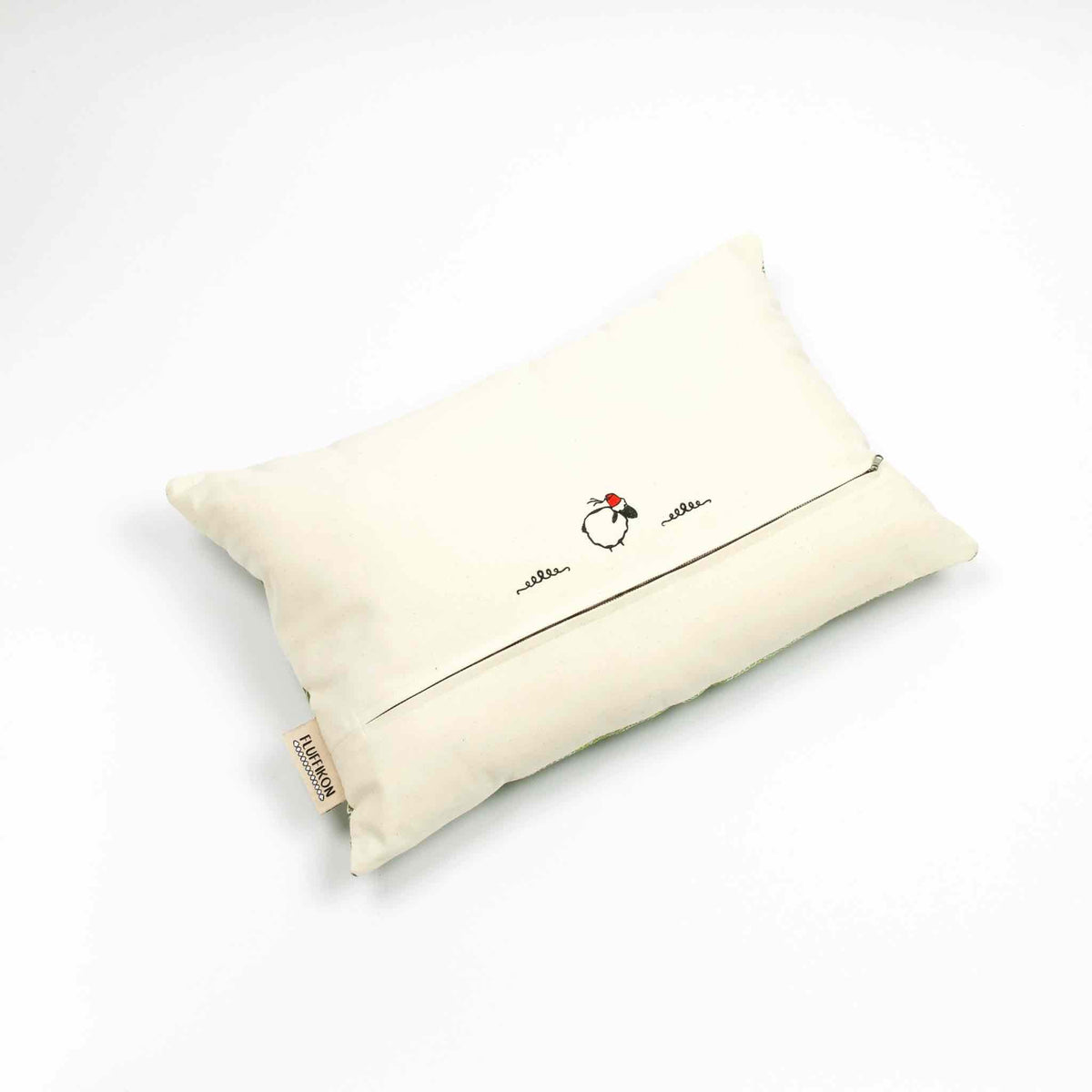 Fluffikon silk rectangular pillow made from green moroccan fabric. The pillow is shown from the back. Size 40x60 cm.