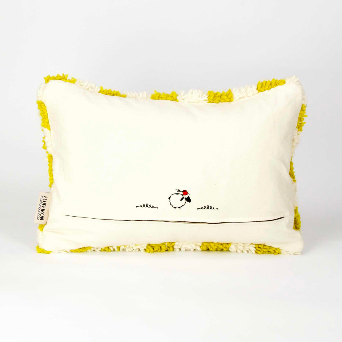 Back view on a Beni Ourain Fluffikon pillow with yellow white checkered pattern. The pillow is made from wool. It stands in front of a white background.