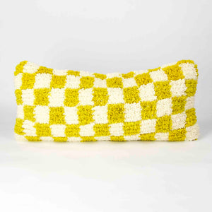 Beni Ourain Fluffikon lumbar pillow with yellow white checkered pattern made from a  wool carpet.