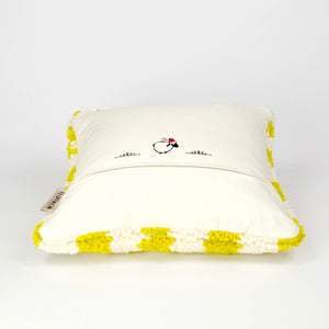 Beni Ourain Fluffikon pillow with yellow white checkered pattern. The pillow is made from wool. It lies on a white ground.