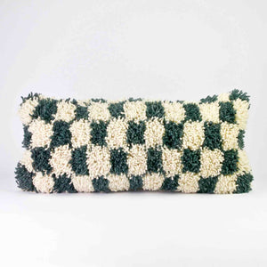Checkered Moroccan Lumbar Pillow. The pillow is standing in front of a white background.