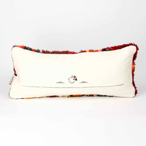 Back view of a vintage Berber pillow in red.