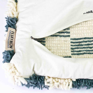 Zoom on the zipper and the Fluffikon label of a checkered Moroccan Lumbar Pillow