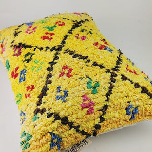 Video of a yellow Boucherouite throw pillow. The video shows a close view of the pillow fabric.