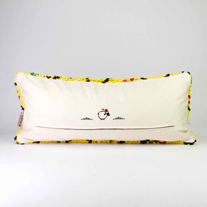 The back of a yellow Boucherouite lumbar pillow.