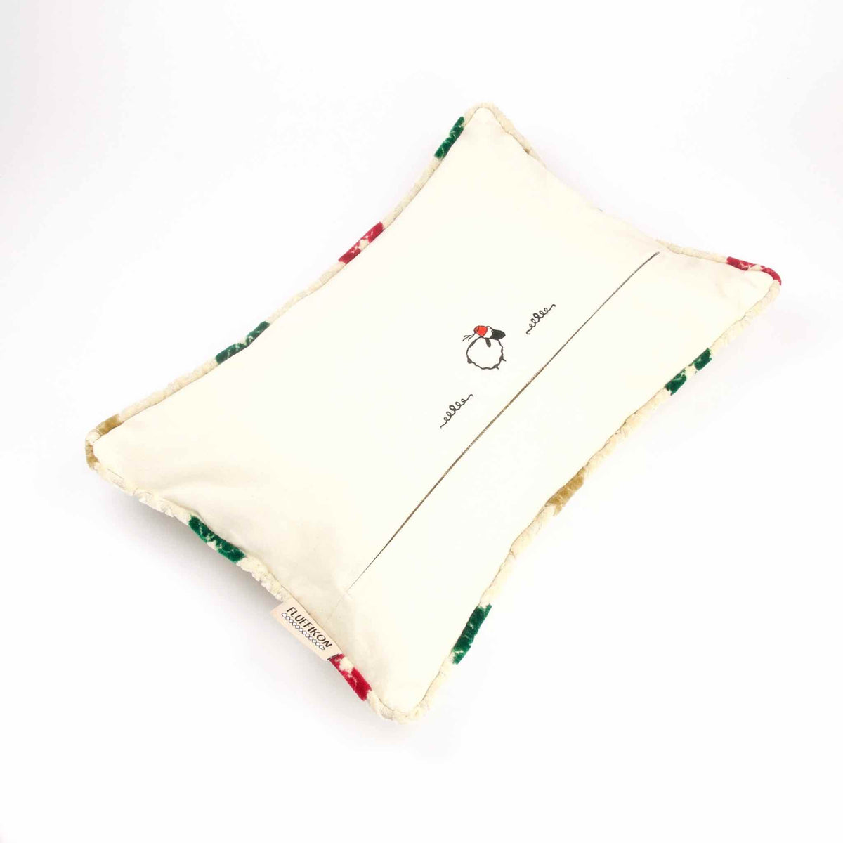 Sofa pillow made from Moroccan velvet on white background.