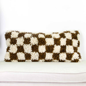  Brown checkered Fluffikon lumbar pillow. The cushion was made from Beni Ourain wool rug.