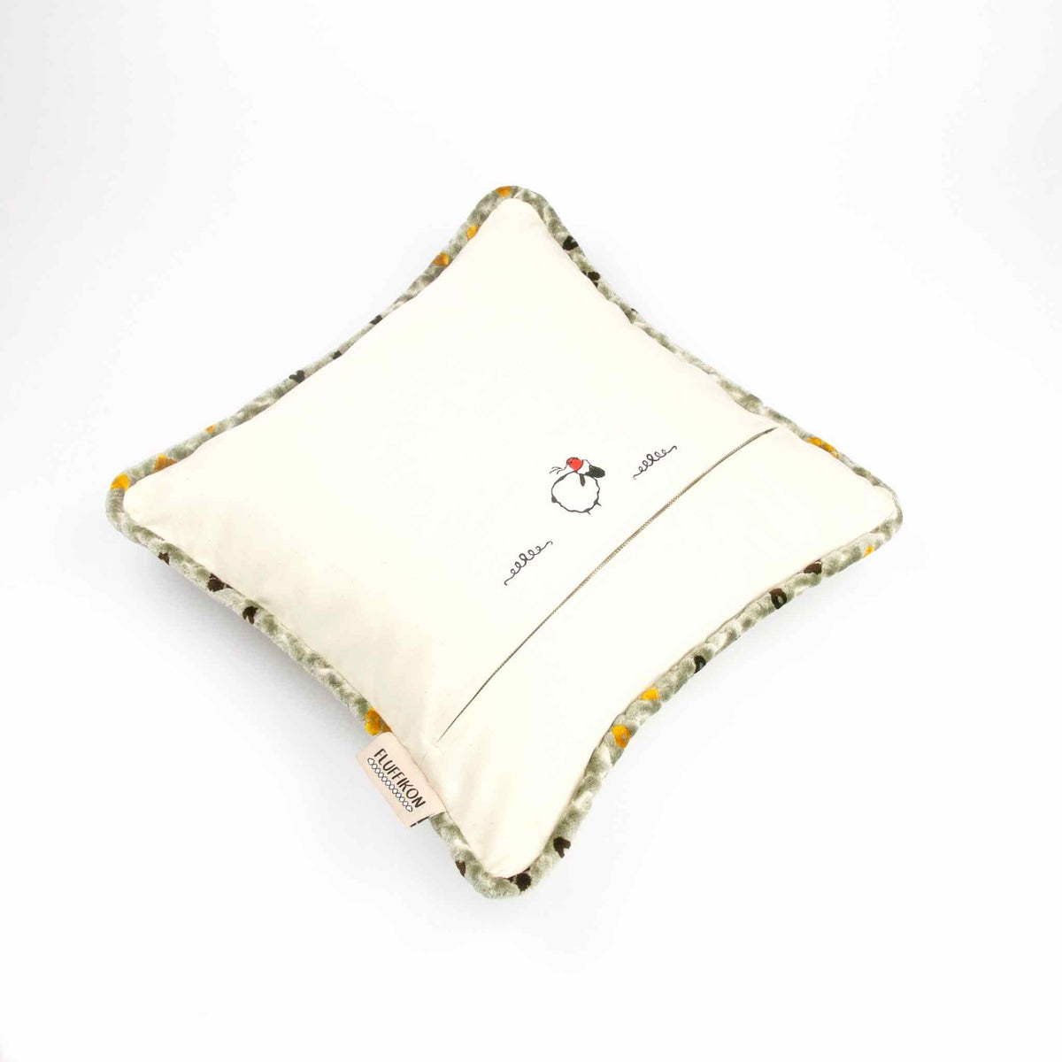 Back of Moroccan throw pillow with piped edges.