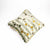 Decorative velvet pillow grey with yellow and brown flowers.