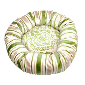 Round green dog bed made from Moroccan velvet fabric.
