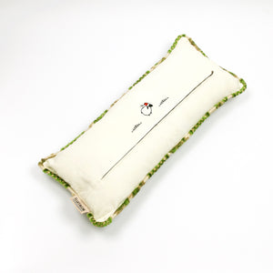 Fluffikon velvet lumbar pillow. Grey and green colours with flowers on it. Pillow shown from the back. Size 35x70 cm.