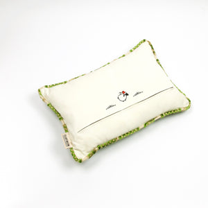Fluffikon grey green decorative pillow with flowers made from a moroccan velvet fabric. The throw pillow is shown from the back.