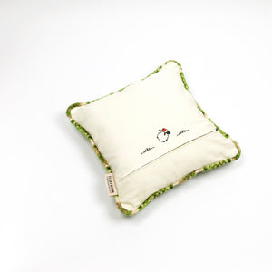 Fluffikon grey green decorative pillow with flowers made from moroccan velvet fabric. The throw pillow is shown from the back.