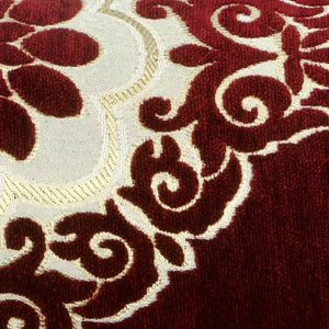 Detailed zoom on red, white, gold velvet fabrics.