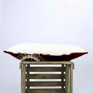 Side view of a large size couch pillow made from velvet fabrics.