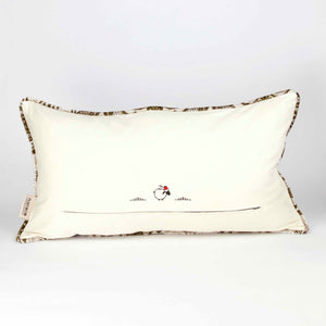 Large couch pillow made from brown beige velvet fabric. The large couch has piped edges. The pillow is shown from the back.