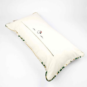 Large pillow with oriental look. The pillow has traditional green moroccan pattern on a beige canvas background. The white pillow back is shown.