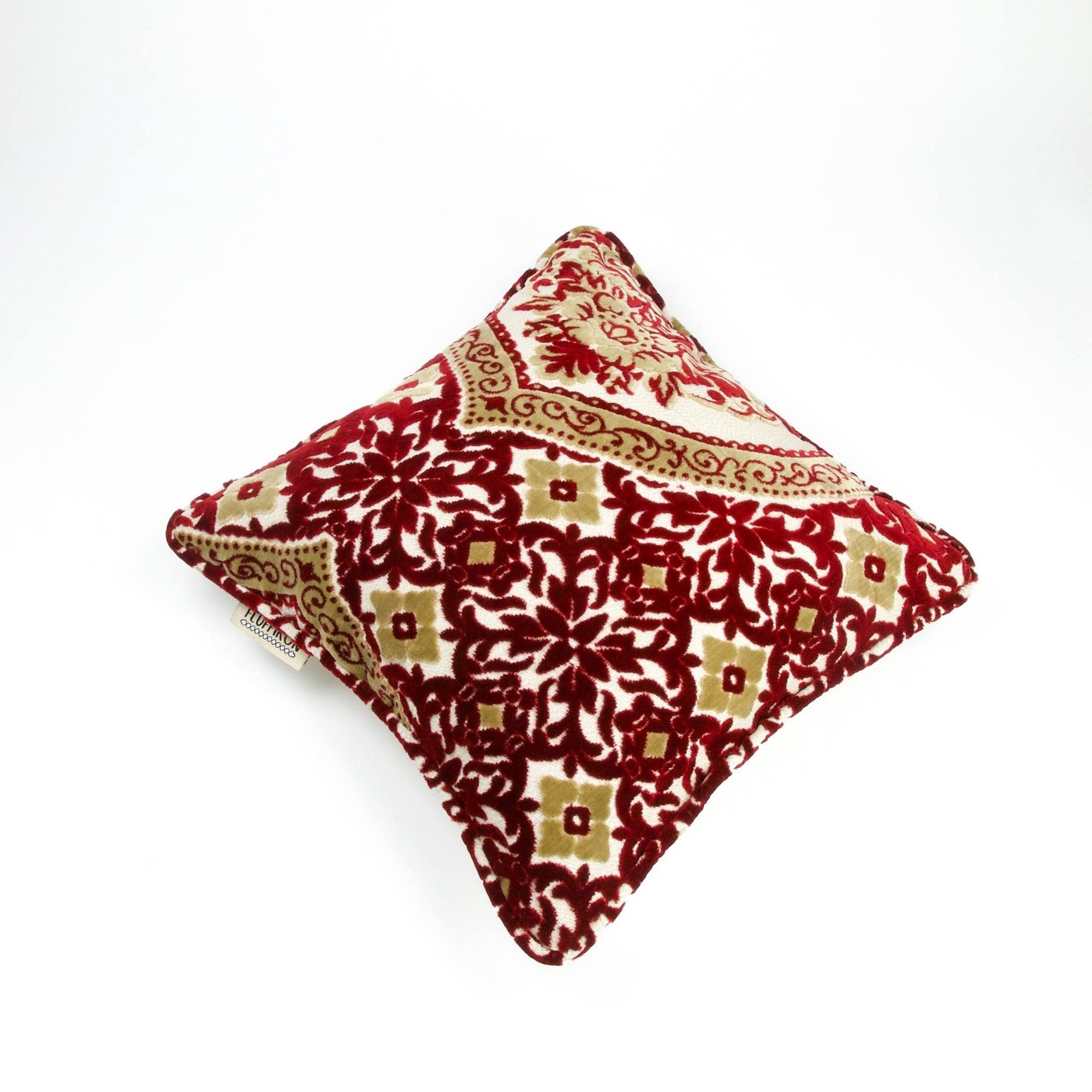 Moroccan couch cushion with red white yellow velvet fabric.