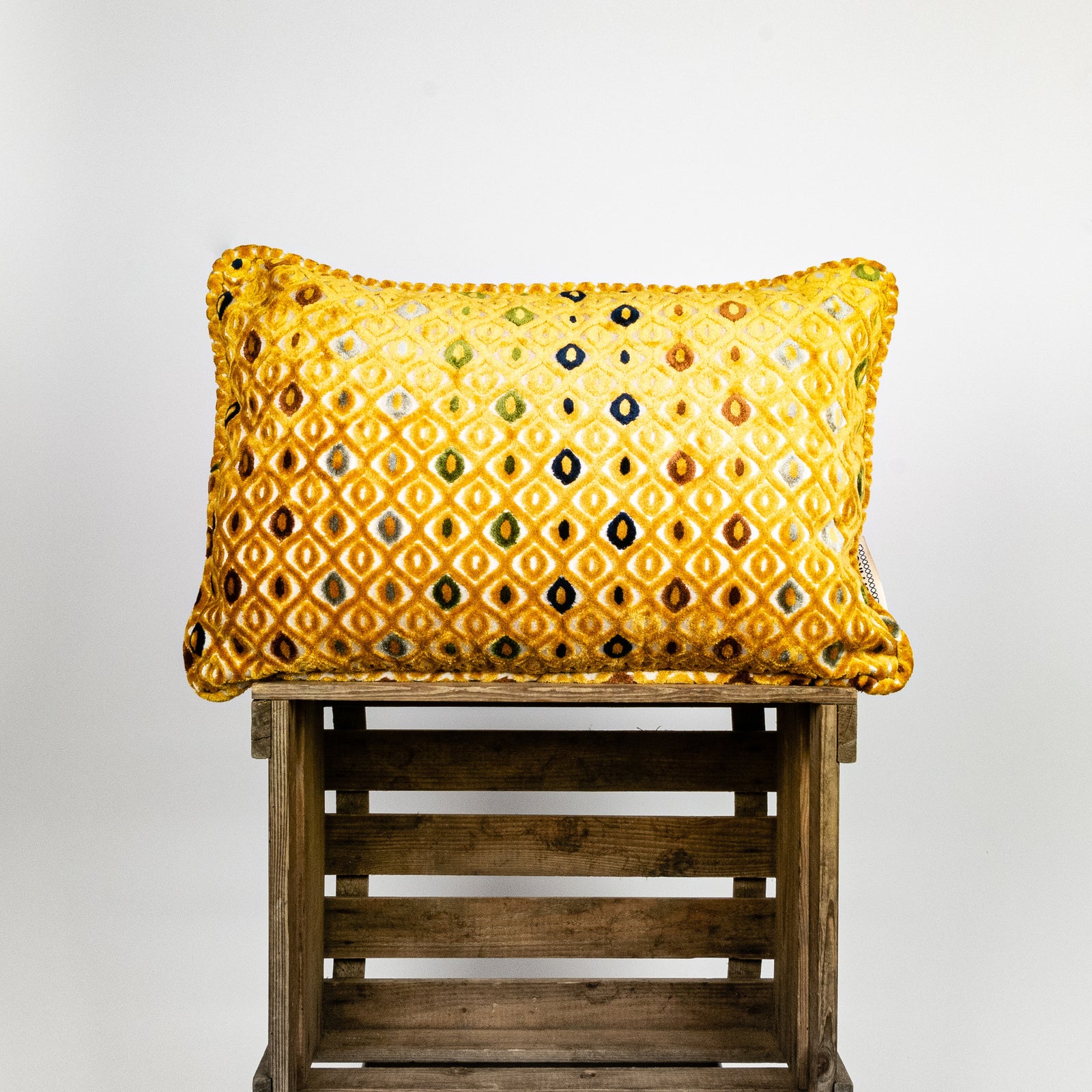 Fluffikon velvet rectangular pillow. It is made from mustard colour fabric.