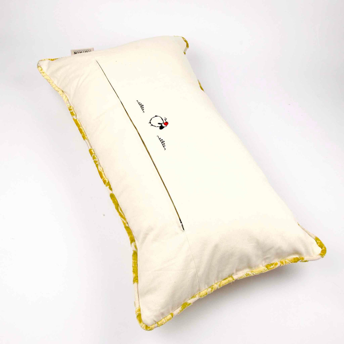 Fluffikon oversized couch pillow made from gold velvet fabric. It has an traditional moroccan / oriental look.  The pillow back is shown.