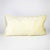 Fluffikon oversized lumbar pillow made from beige velvet with golden threads.
