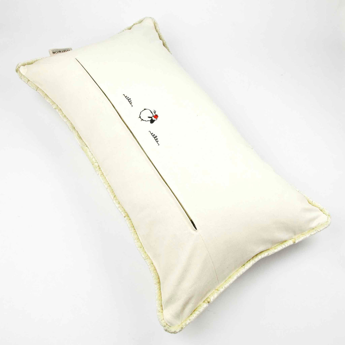 Fluffikon oversized lumbar pillow made from beige velvet with golden threads. The view is on the pillow back.