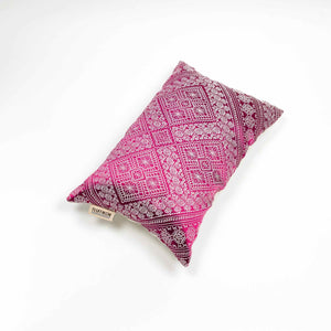 Fluffikon rectangular decorative pillow. The throw pillow is made from pink-white moroccan silk fabric. The pillow is shown from the top. Size 40x60 cm.