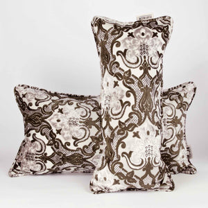 Two large couch pillows made from brown beige velvet fabric. The pillows have an oriental / moroccan look. 