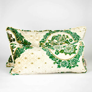 Two large pillows with oriental look on white background. The pillows are standing in front of each other.