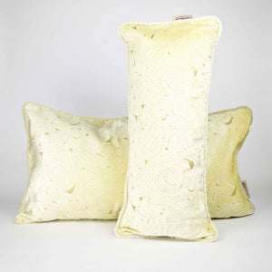 Two Fluffikon oversized lumbar pillows made from beige velvet with golden threads.