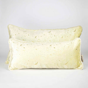 Two Fluffikon oversized lumbar pillows made from beige velvet with golden threads. The pillows have an oriental look.