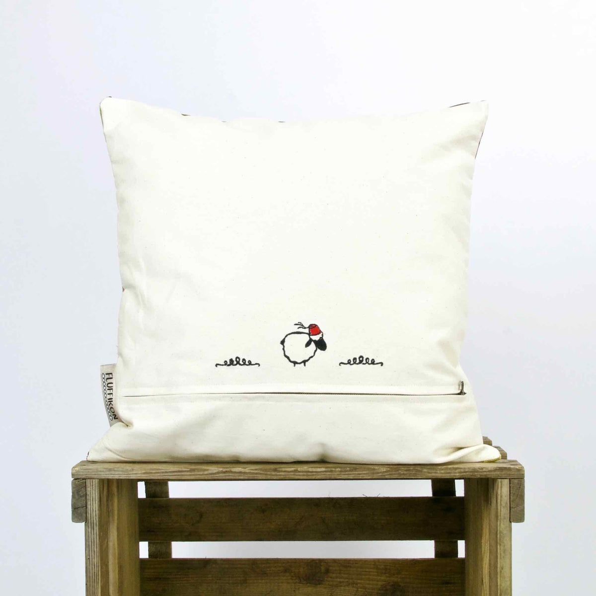 The back view of yellow red sofa pillow with velvet material. Same material as the matching Fluffikon dog bed.