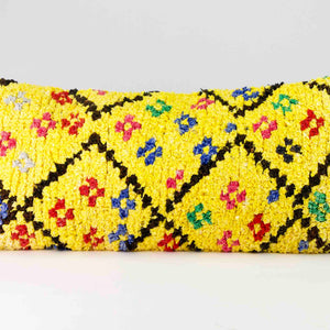 Yellow Boucherouite lumbar pillow. A close view on the long pillow is shown. The size is 35x70 cm.