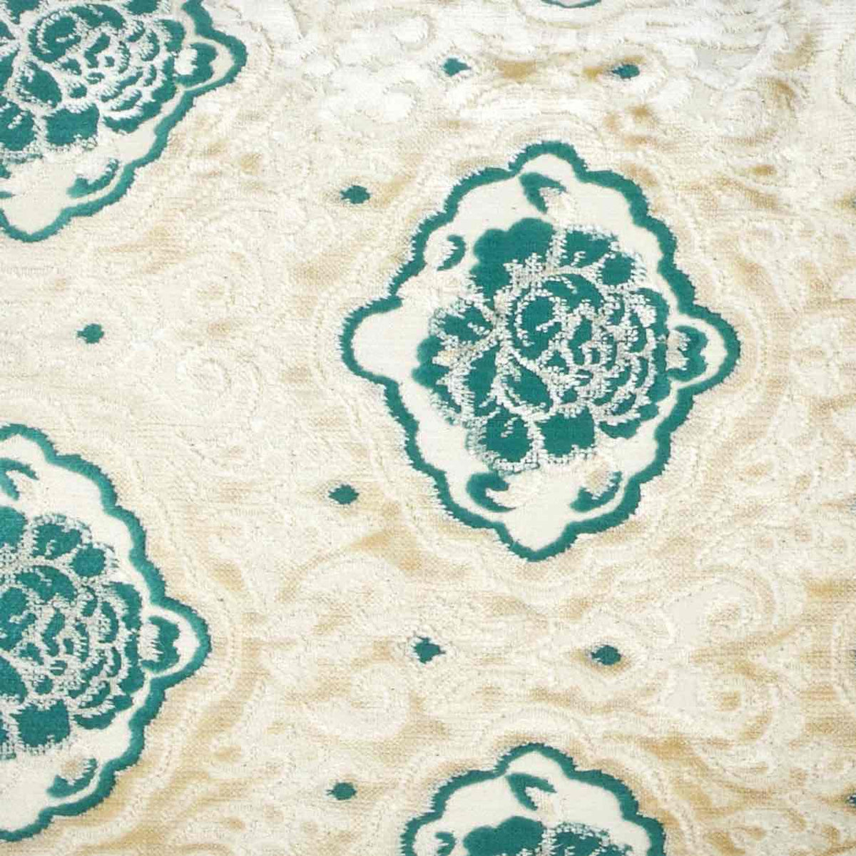 Zoom on beige green velvet fabric of a oversize throw pillow.