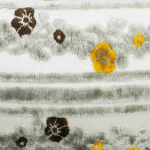 Detailed view on grey velvet with yellow and brown flowers